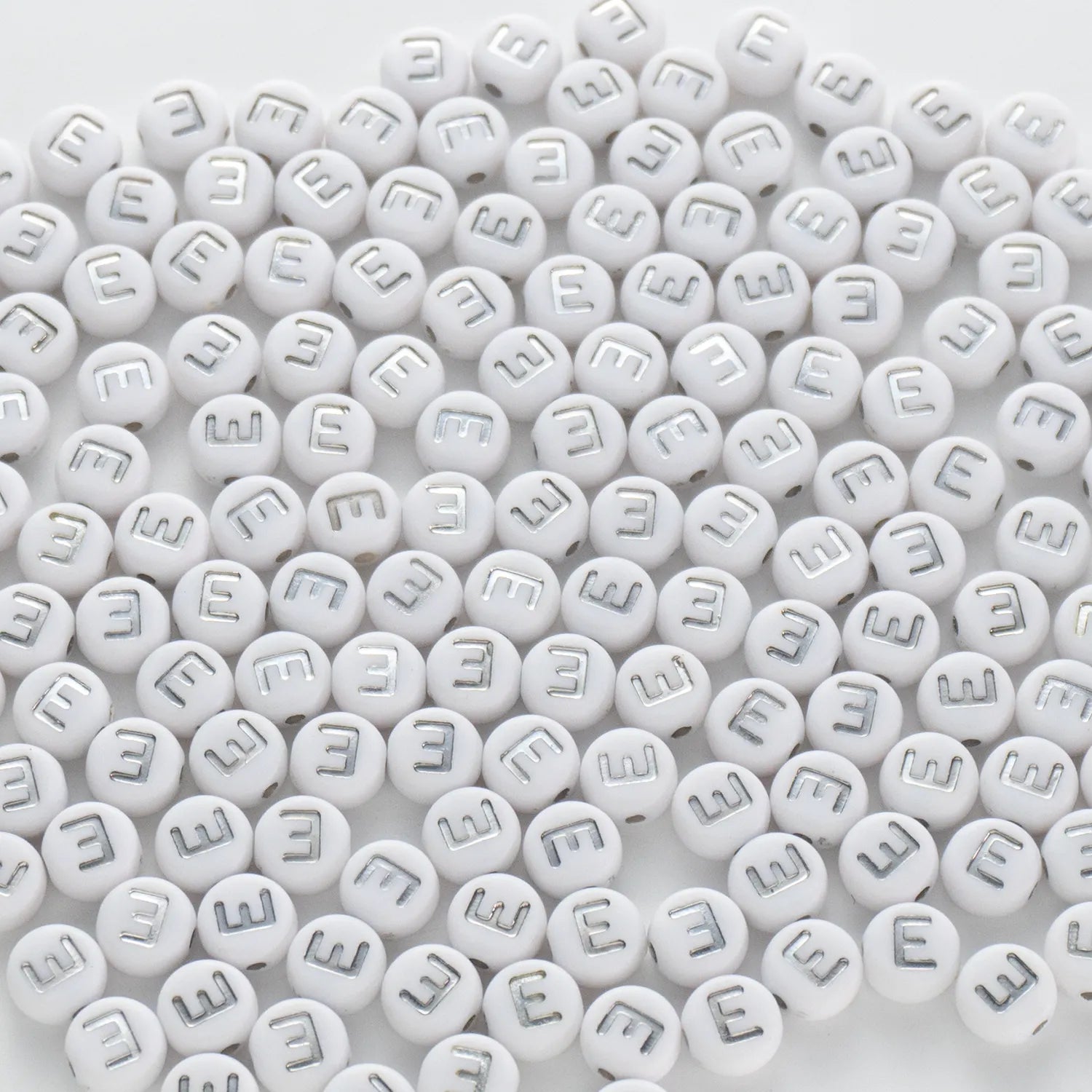 BD00088-02-silver-letter-white-opaque-coin-alphabet-beads-single-e-4×7mm
