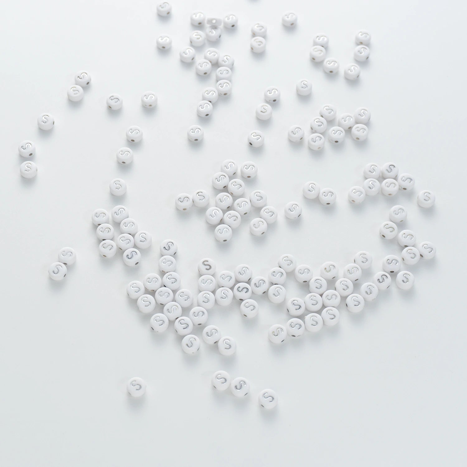 BD00102-04-silver-letter-white-opaque-coin-alphabet-beads-single-s-4×7mm