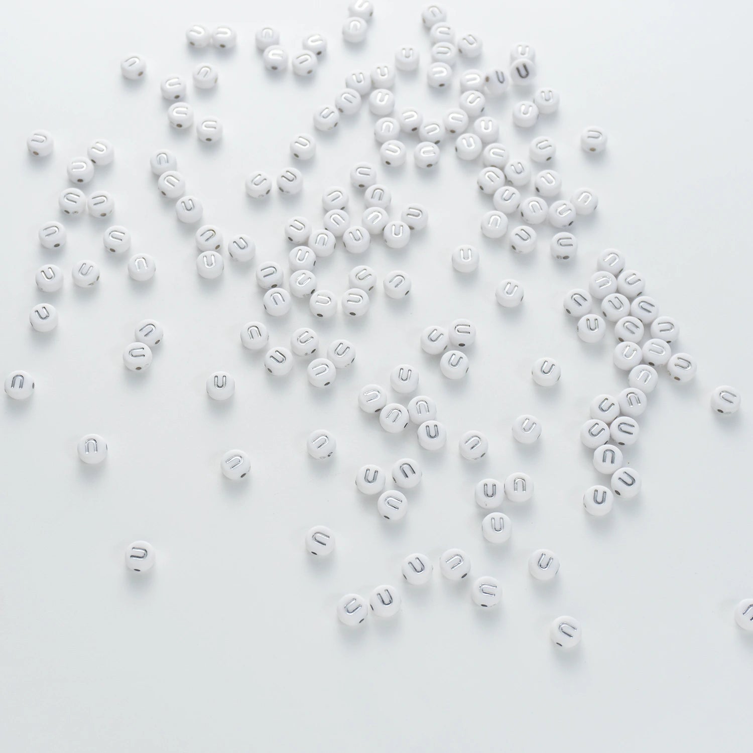 BD00104-04-silver-letter-white-opaque-coin-alphabet-beads-single-u-4×7mm