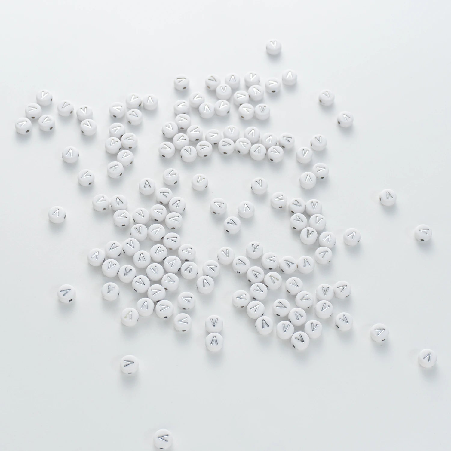 BD00105-03-silver-letter-white-opaque-coin-alphabet-beads-single-v-4×7mm