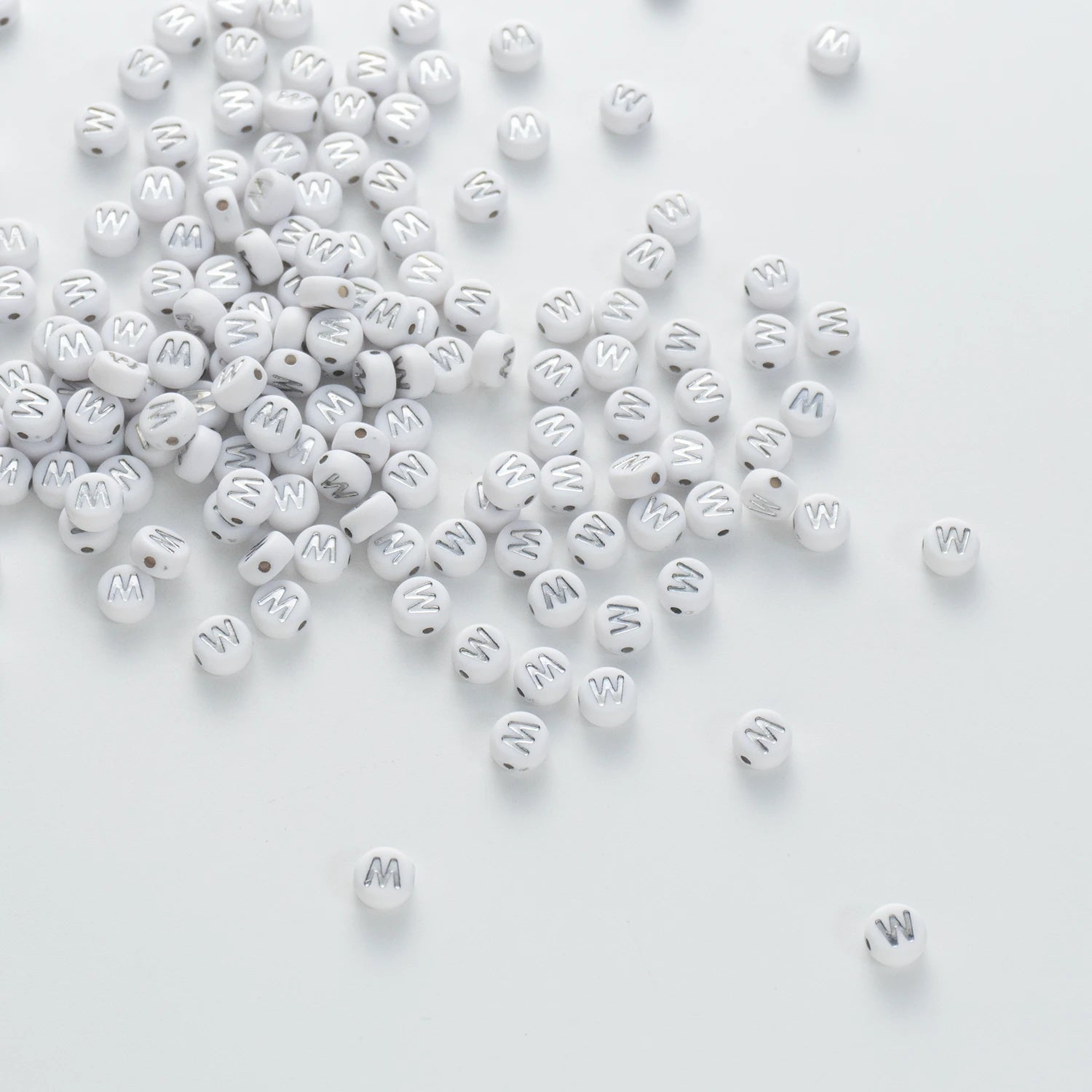 BD00106-04-silver-letter-white-opaque-coin-alphabet-beads-single-w-4×7mm