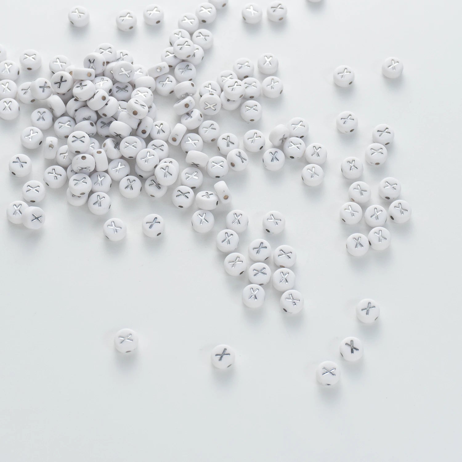 BD00107-04-silver-letter-white-opaque-coin-alphabet-beads-single-x-4×7mm