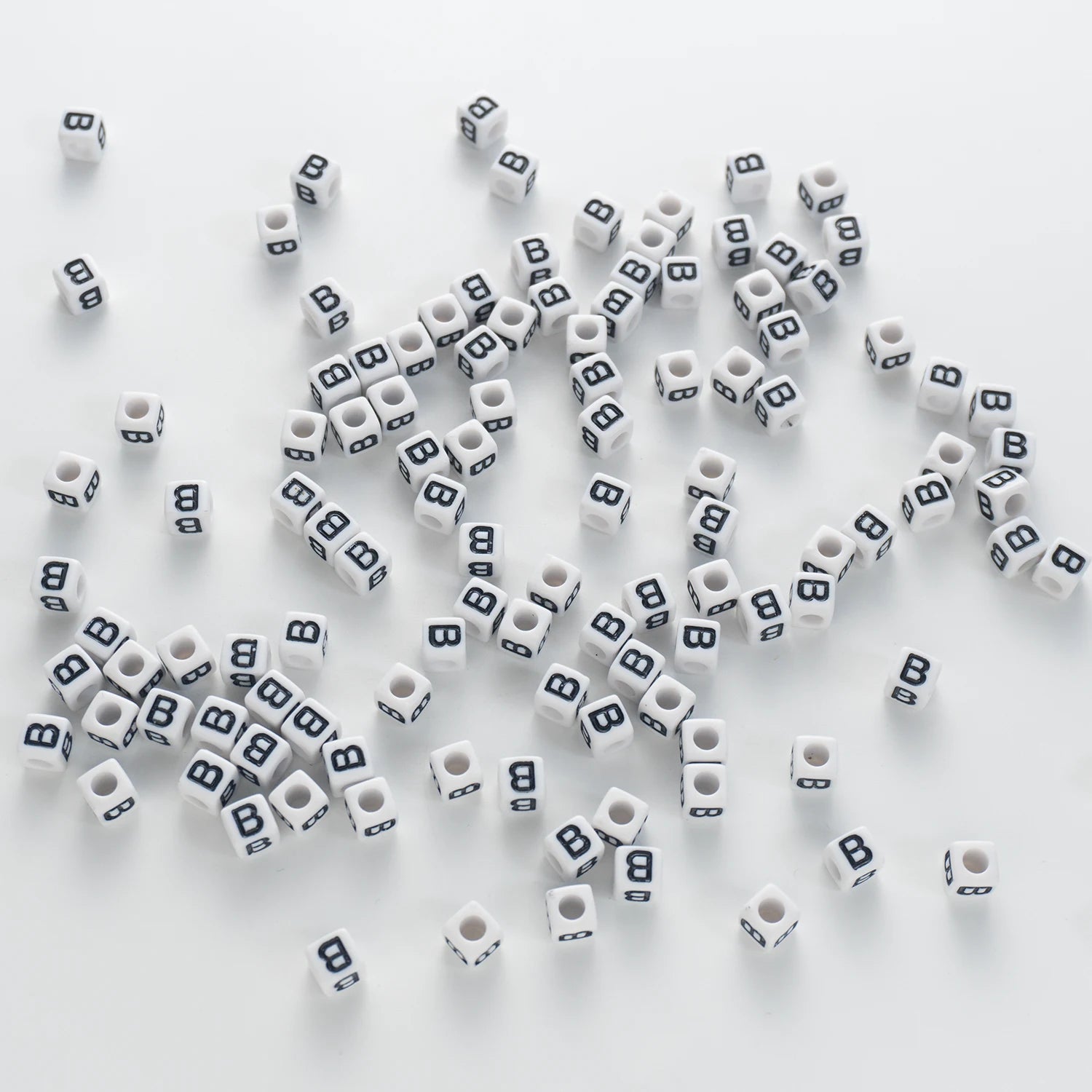 BD00113-03-black-letter-white-opaque-cube-alphabet-beads-single-b-7mm