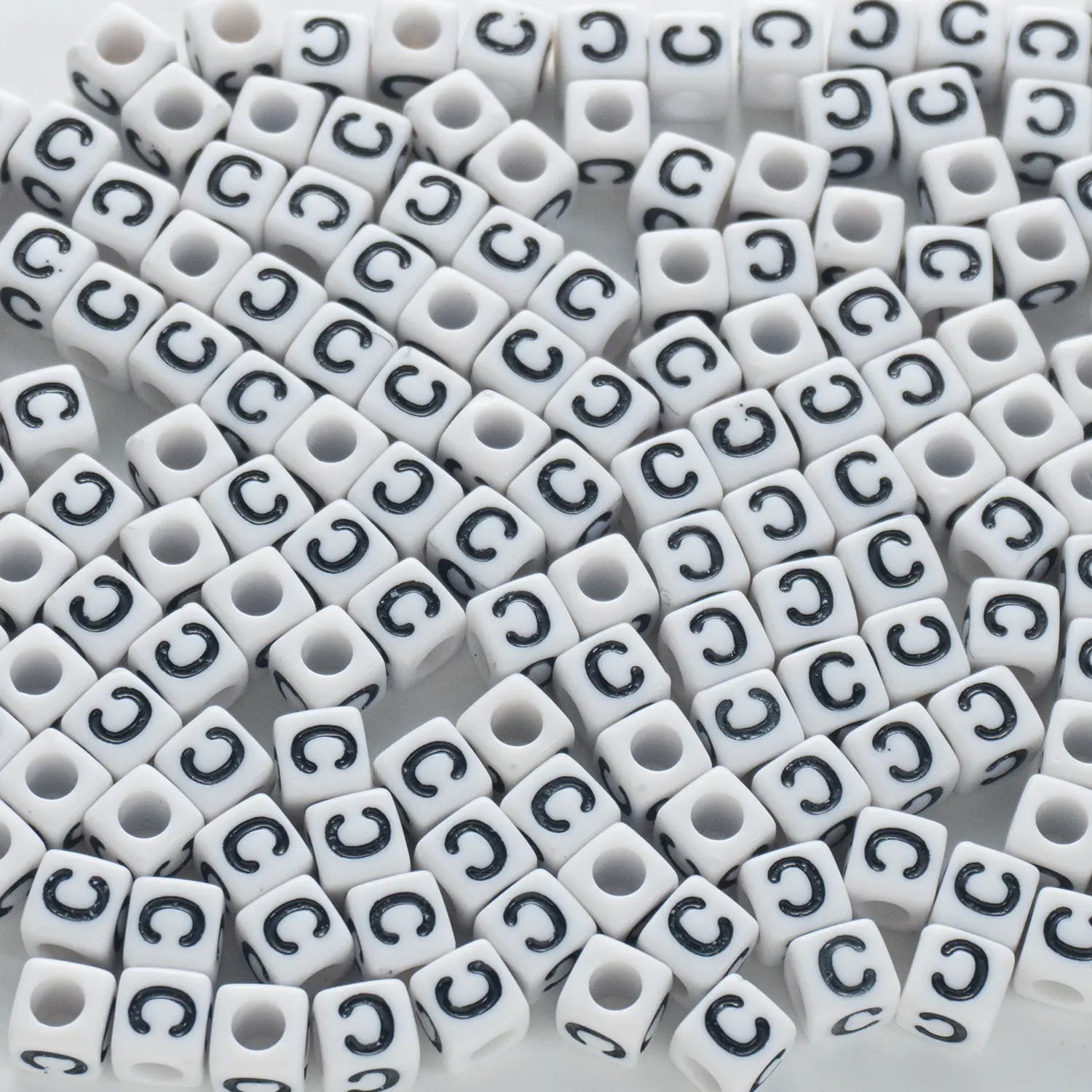 BD00114-02-black-letter-white-opaque-cube-alphabet-beads-single-c-7mm