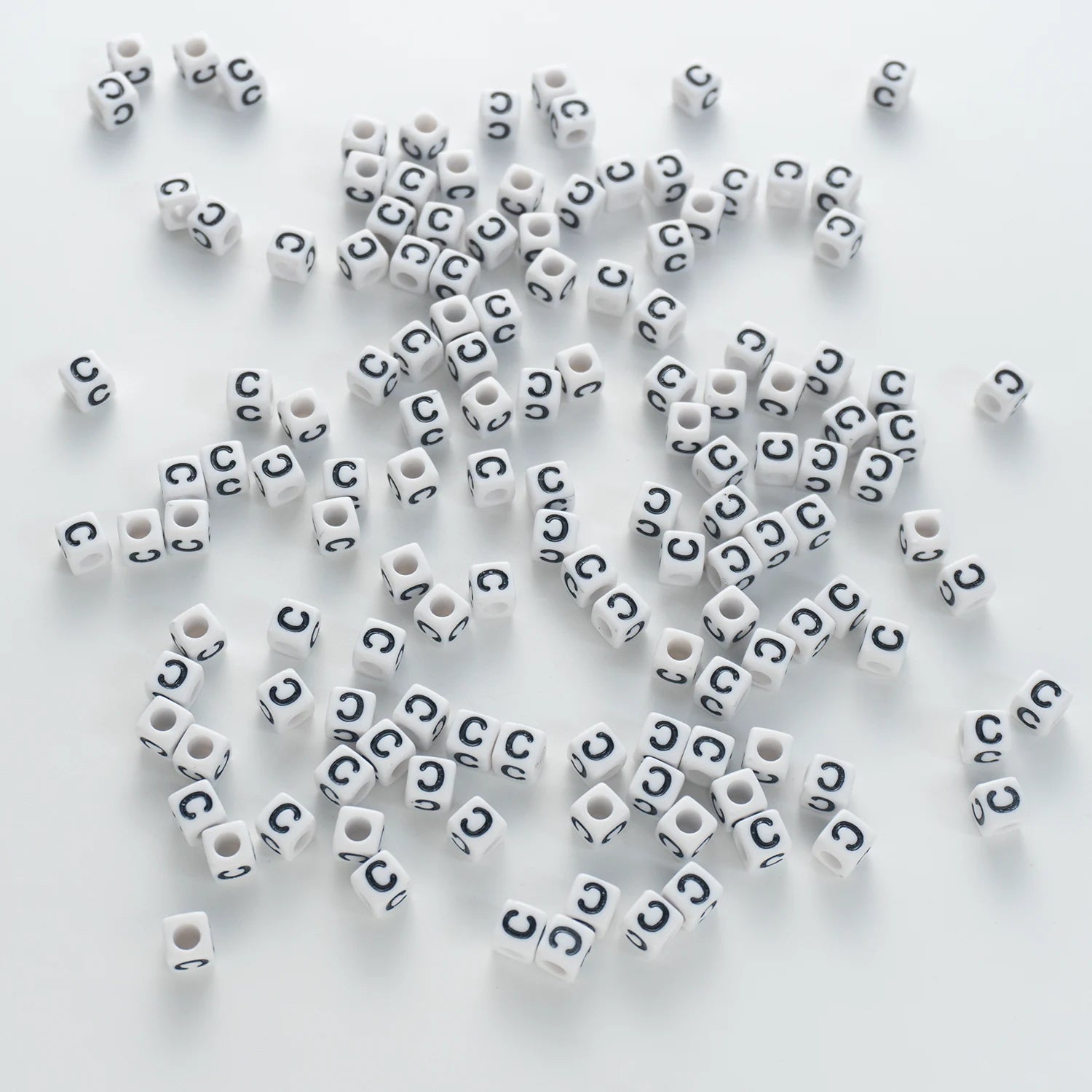 BD00114-03-black-letter-white-opaque-cube-alphabet-beads-single-c-7mm