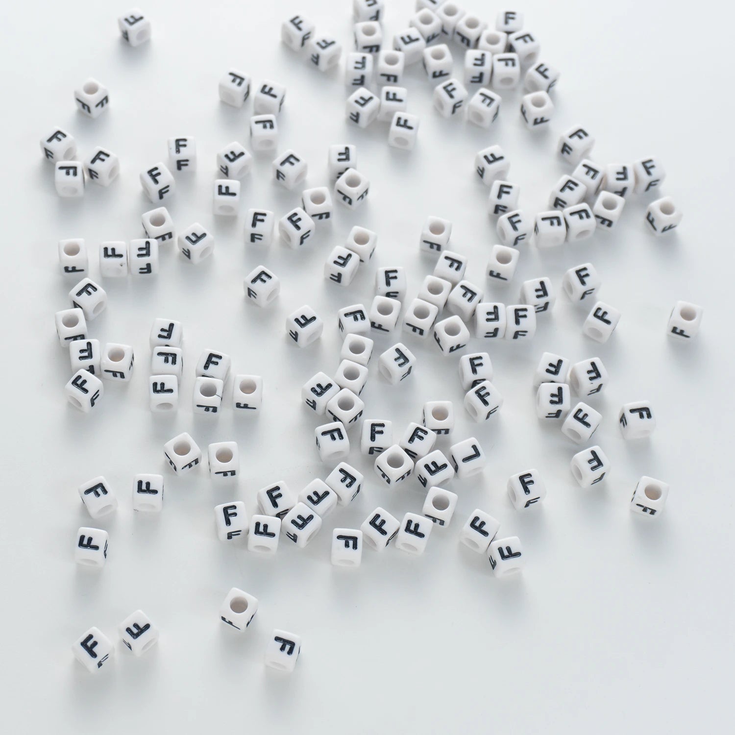 BD00117-03-black-letter-white-opaque-cube-alphabet-beads-single-f-7mm