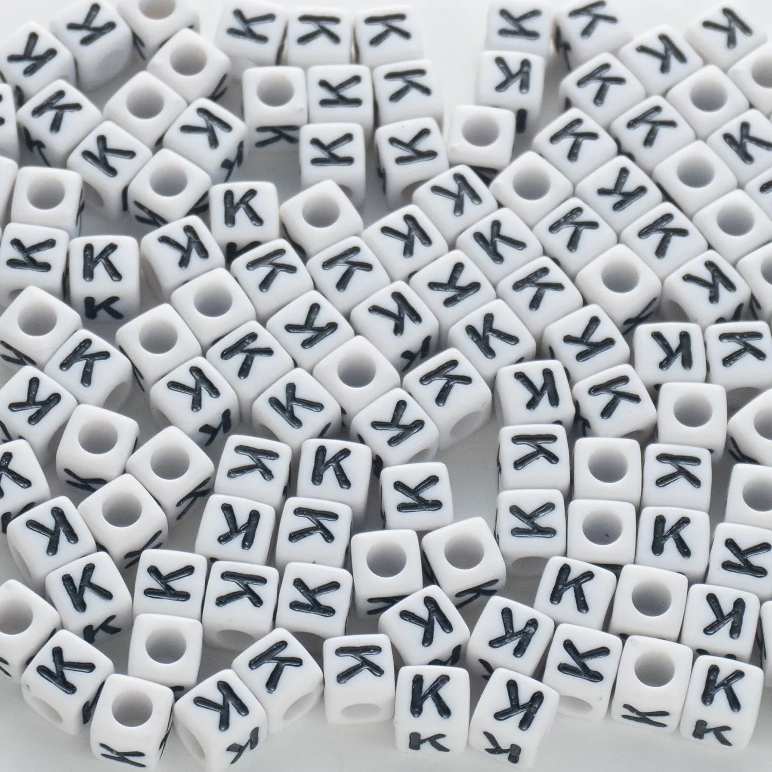BD00122-02-black-letter-white-opaque-cube-alphabet-beads-single-k-7mm