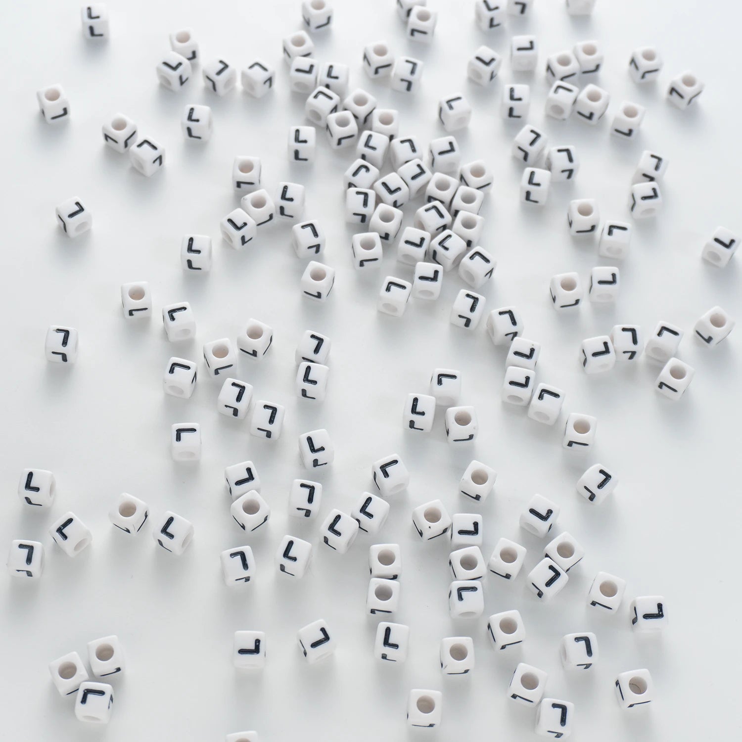 BD00123-03-black-letter-white-opaque-cube-alphabet-beads-single-l-7mm