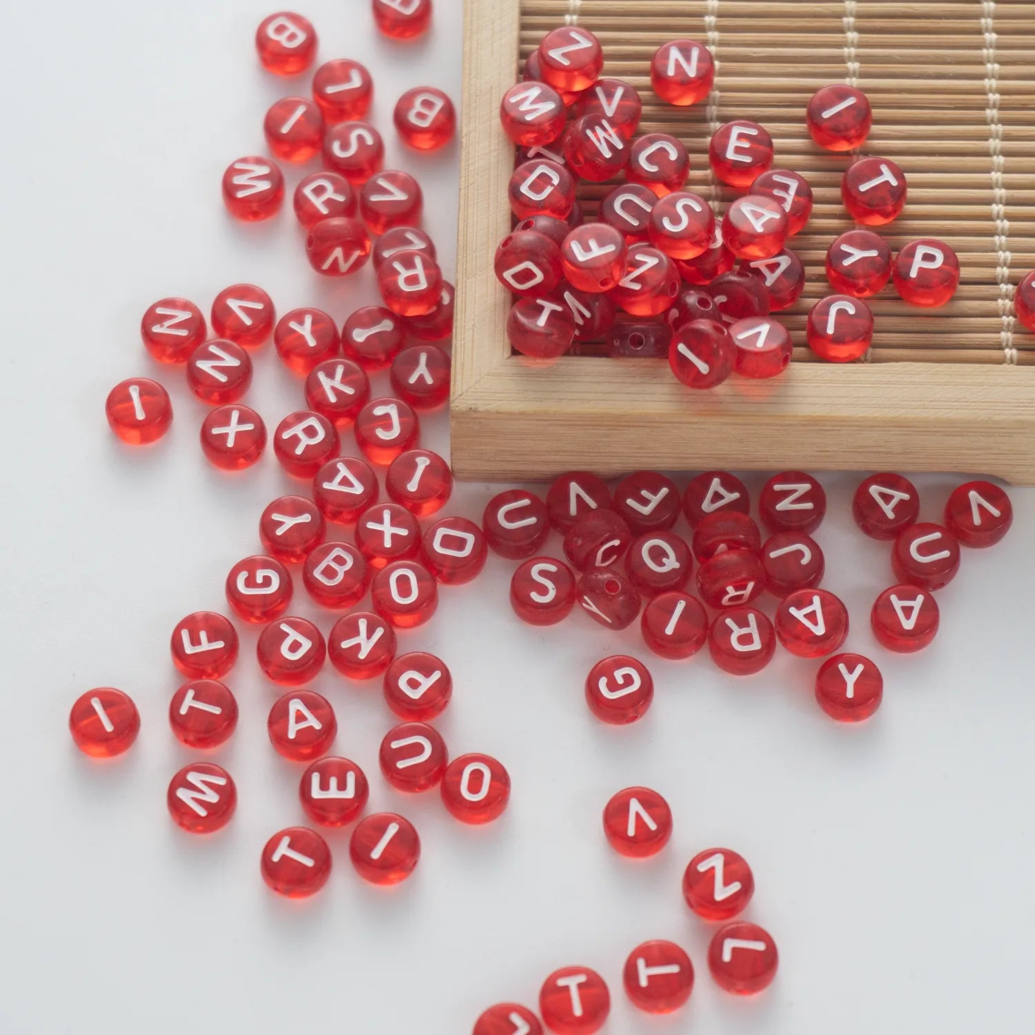 BW-00057-BD-05-white-letter-dark-red-transparent-coin-alphabet-beads-mix-4×7mm