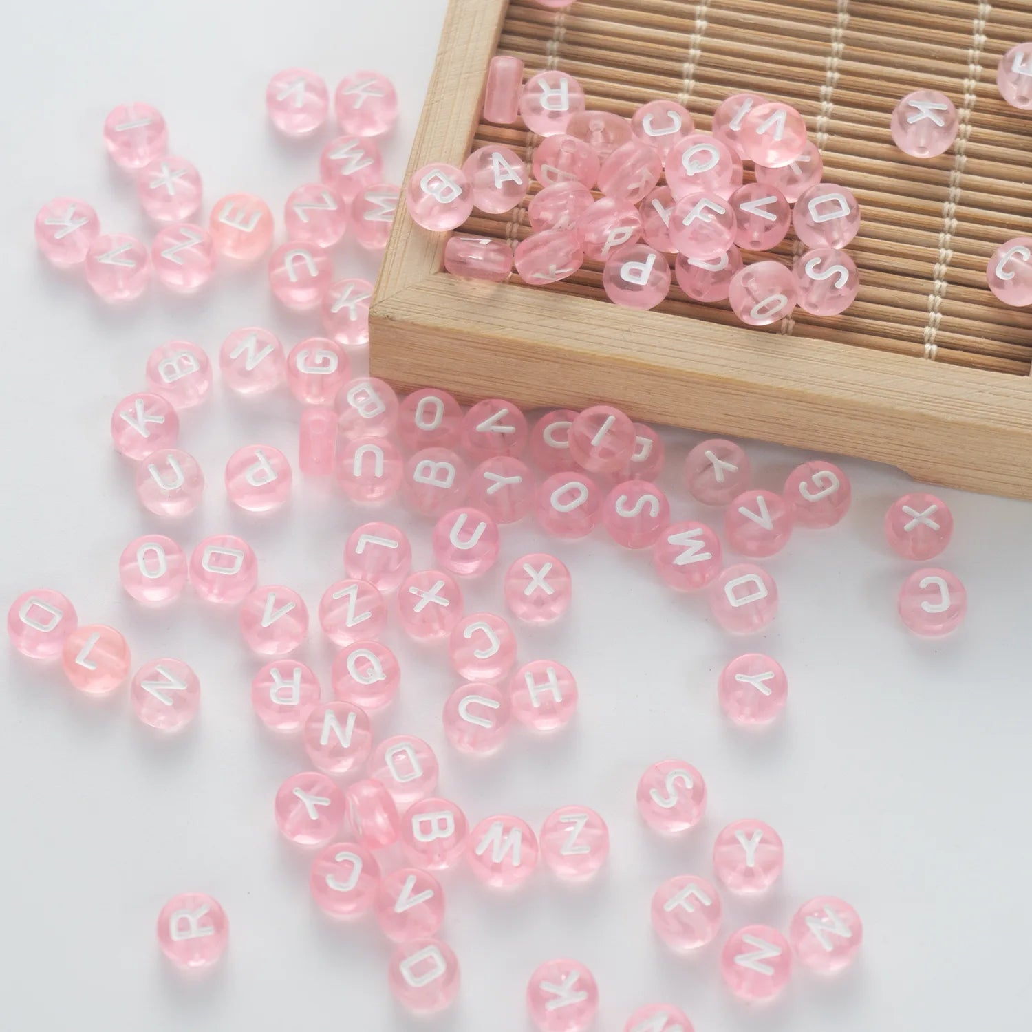 BW-00061-BD-05-white-letter-pastel-pink-transparent-coin-alphabet-beads-mix-4×7mm