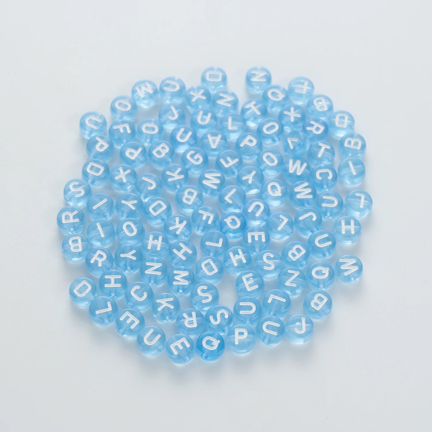 BW-00064-BD-02-white-letter-light-blue-transparent-coin-alphabet-beads-mix-4×7mm