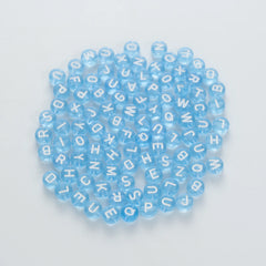 BW-00064-BD-02-white-letter-light-blue-transparent-coin-alphabet-beads-mix-4×7mm