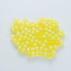 BW-00075-BD-02-white-letter-bright-yellow-transparent-cube-alphabet-beads-mix-6mm