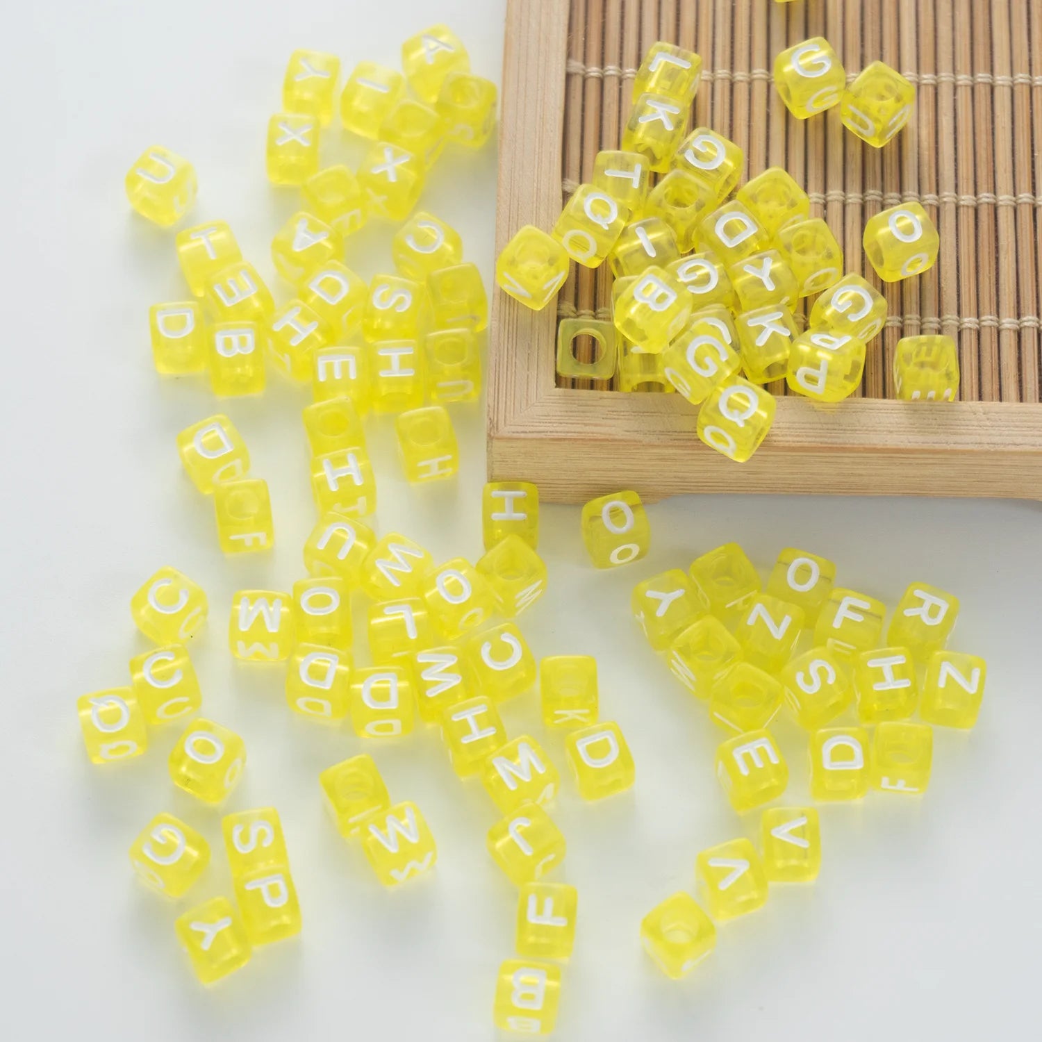 BW-00075-BD-05-white-letter-bright-yellow-transparent-cube-alphabet-beads-mix-6mm