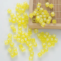 BW-00075-BD-05-white-letter-bright-yellow-transparent-cube-alphabet-beads-mix-6mm
