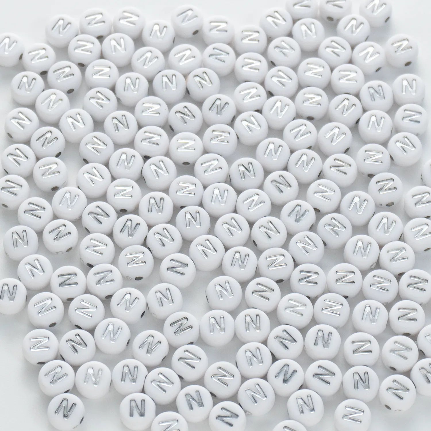 BW-00097-BD-02-silver-letter-white-opaque-coin-alphabet-beads-single-n-4×7mm