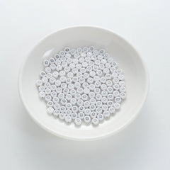 BW-00100-BD-01-silver-letter-white-opaque-coin-alphabet-beads-single-q-4×7mm