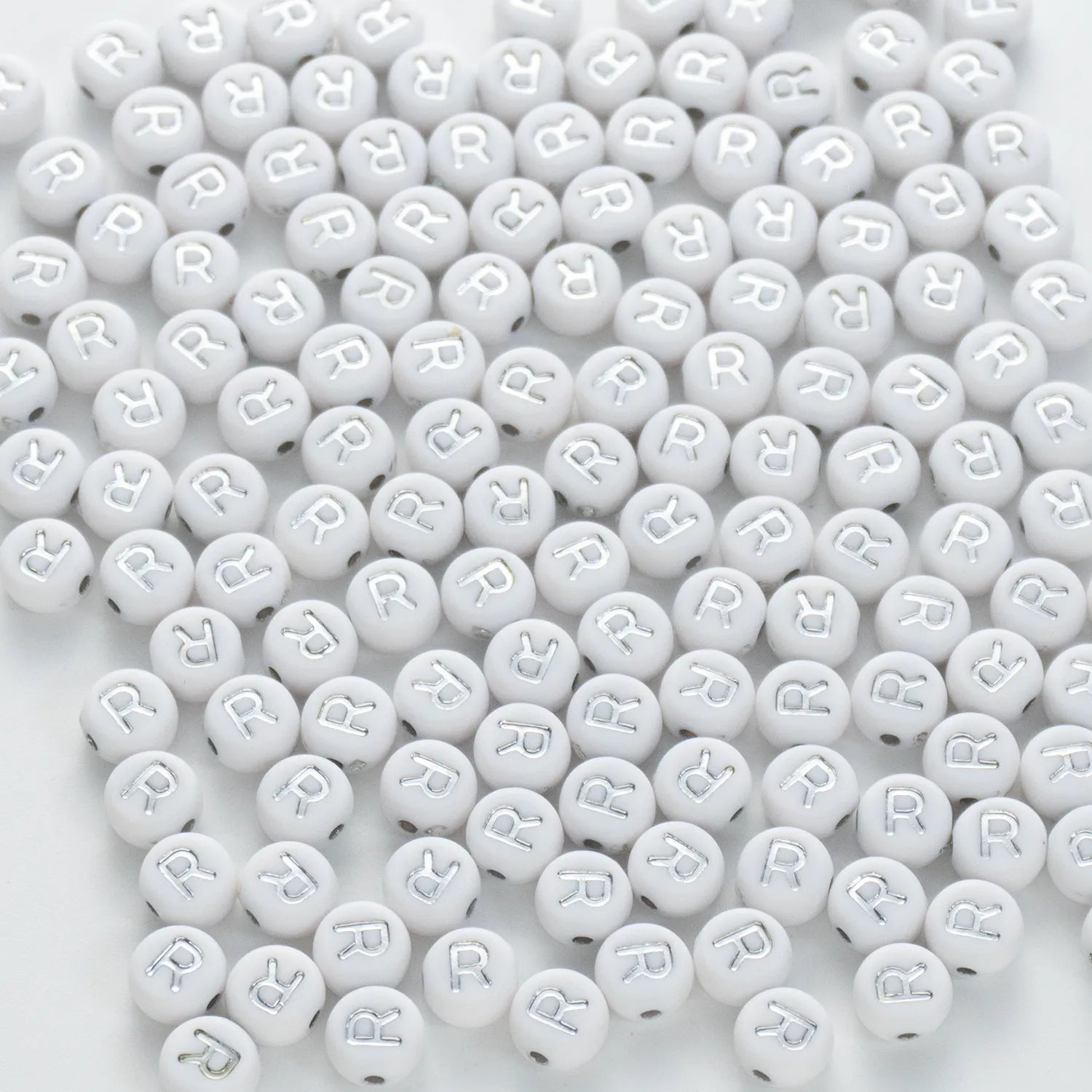 BW-00101-BD-02-silver-letter-white-opaque-coin-alphabet-beads-single-r-4×7mm