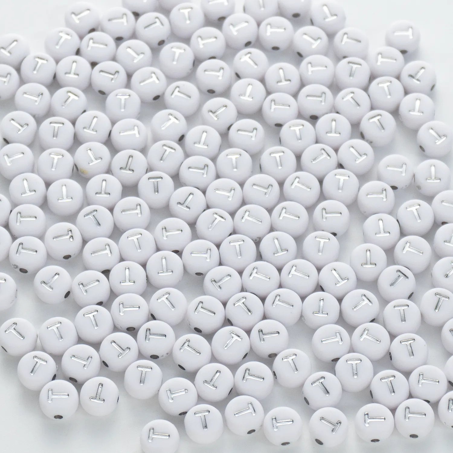 BW-00103-BD-02-silver-letter-white-opaque-coin-alphabet-beads-single-t-4×7mm