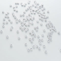 BW-00104-BD-04-silver-letter-white-opaque-coin-alphabet-beads-single-u-4×7mm