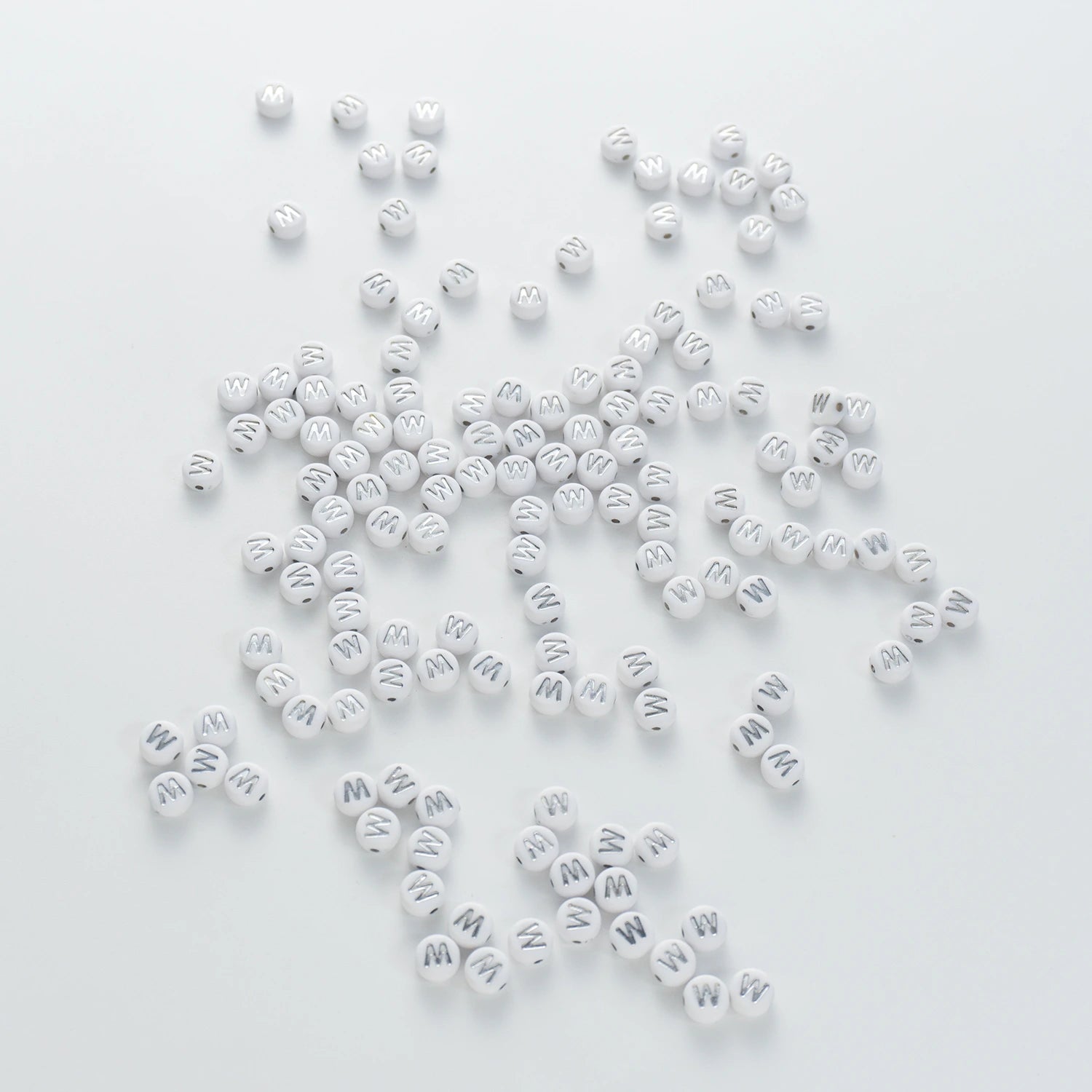 BW-00106-BD-03-silver-letter-white-opaque-coin-alphabet-beads-single-w-4×7mm