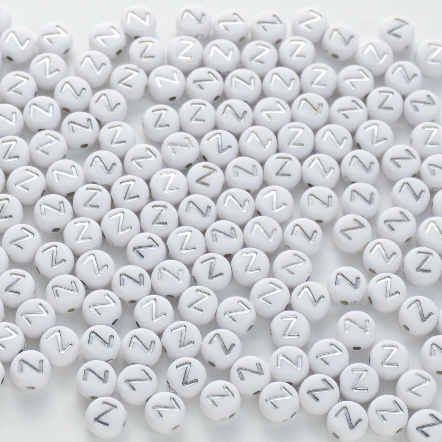 BW-00109-BD-02-silver-letter-white-opaque-coin-alphabet-beads-single-z-4×7mm