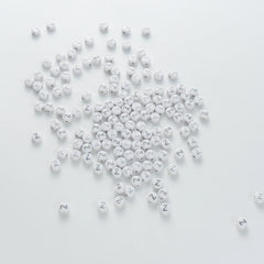 BW-00109-BD-03-silver-letter-white-opaque-coin-alphabet-beads-single-z-4×7mm