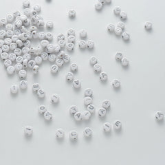 BW-00110-BD-04-silver-letter-white-opaque-coin-vowel-alphabet-beads-mix-4×7mm
