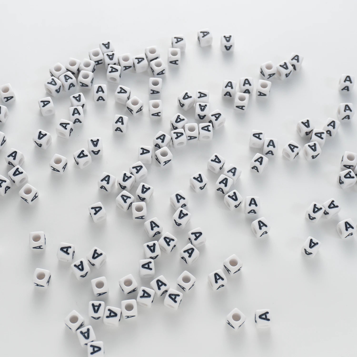 BW-00112-BD-03-black-letter-white-opaque-cube-alphabet-beads-single-a-7mm