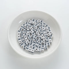 BW-00116-BD-01-black-letter-white-opaque-cube-alphabet-beads-single-e-7mm