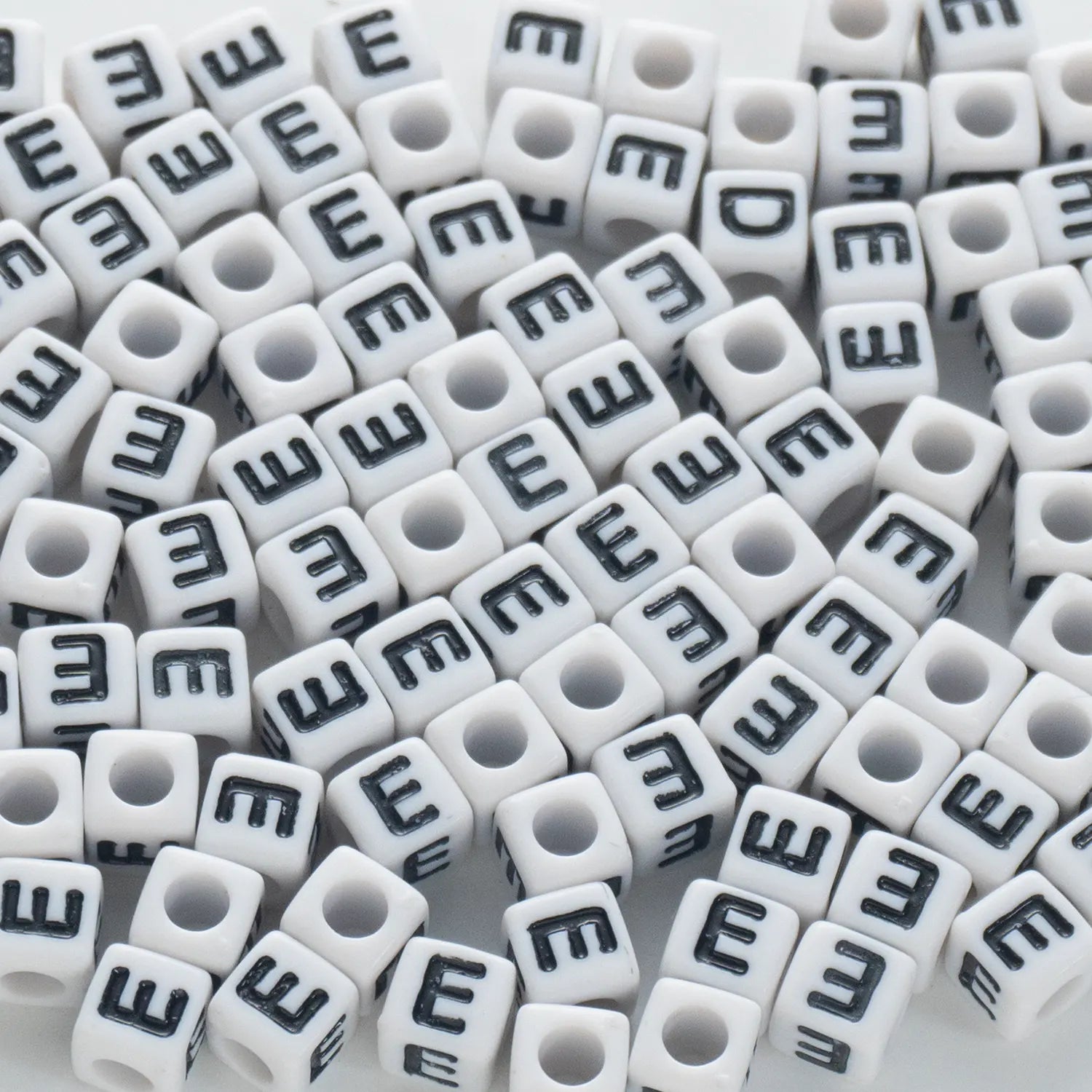 BW-00116-BD-02-black-letter-white-opaque-cube-alphabet-beads-single-e-7mm