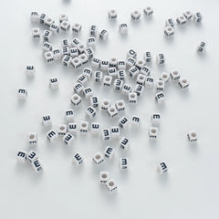 BW-00116-BD-03-black-letter-white-opaque-cube-alphabet-beads-single-e-7mm